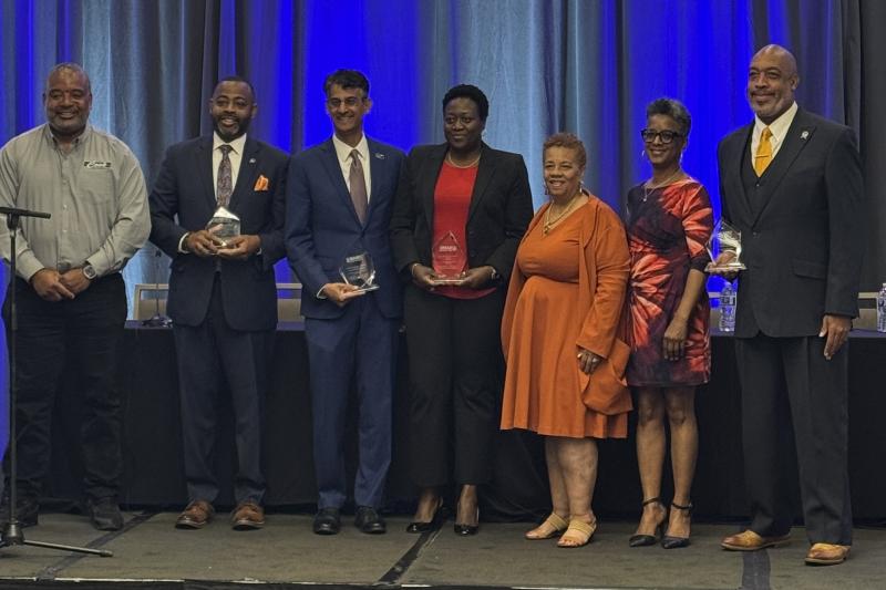NAMC presenting Council President and others with an award